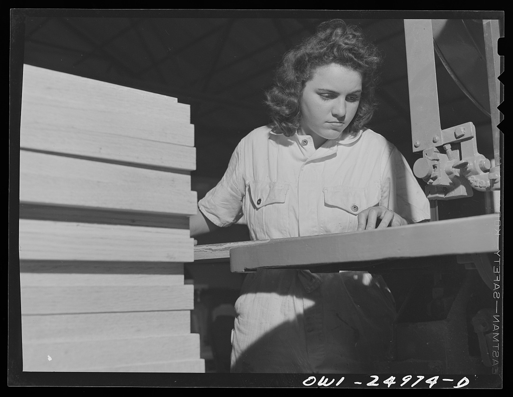 A young woman learns chair-making in a National Youth Administration workshop, 1943