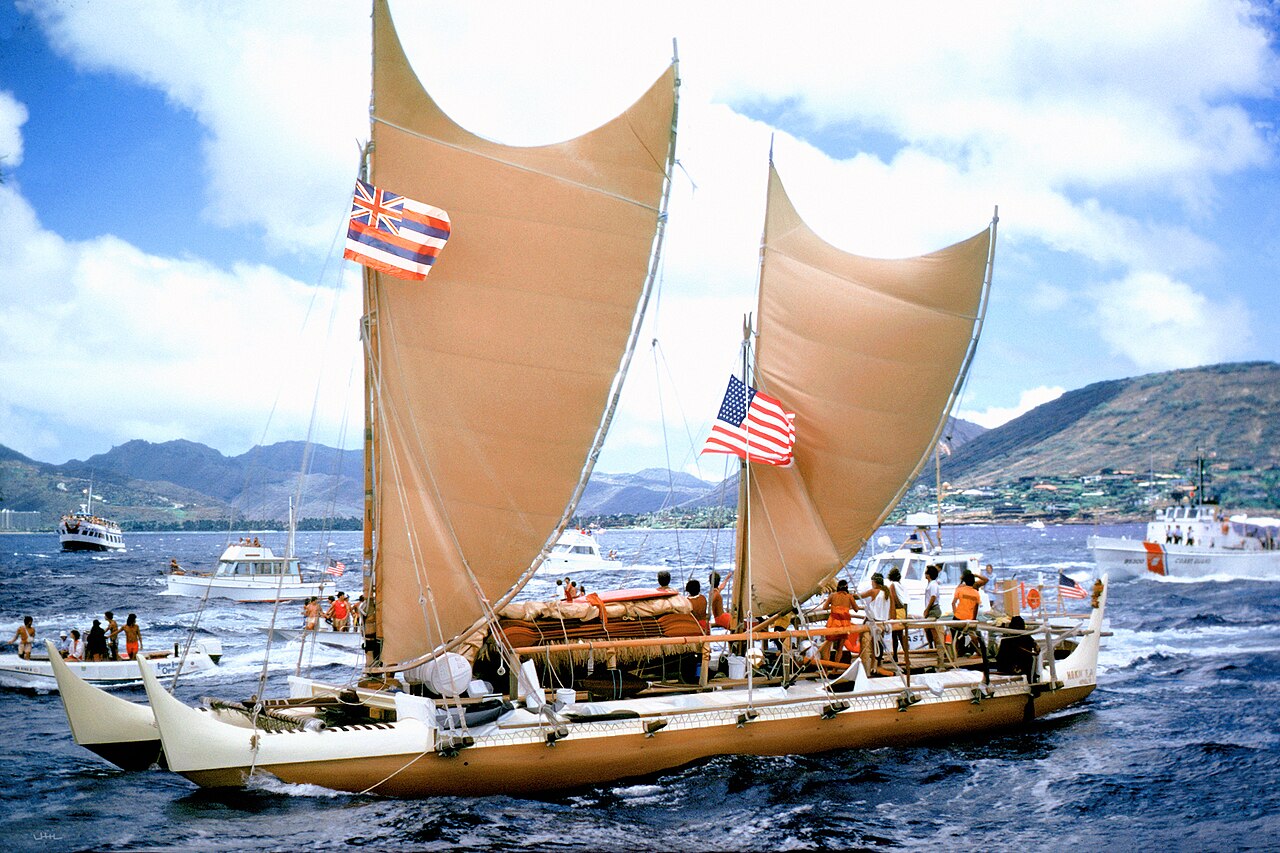 The double-hulled Hawaiian voyaging canoe Hōkūleʻa sailing into Honolulu after returning from Tahiti in 1976